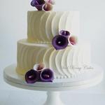 Textured buttercream with plum sugar calla lilies.